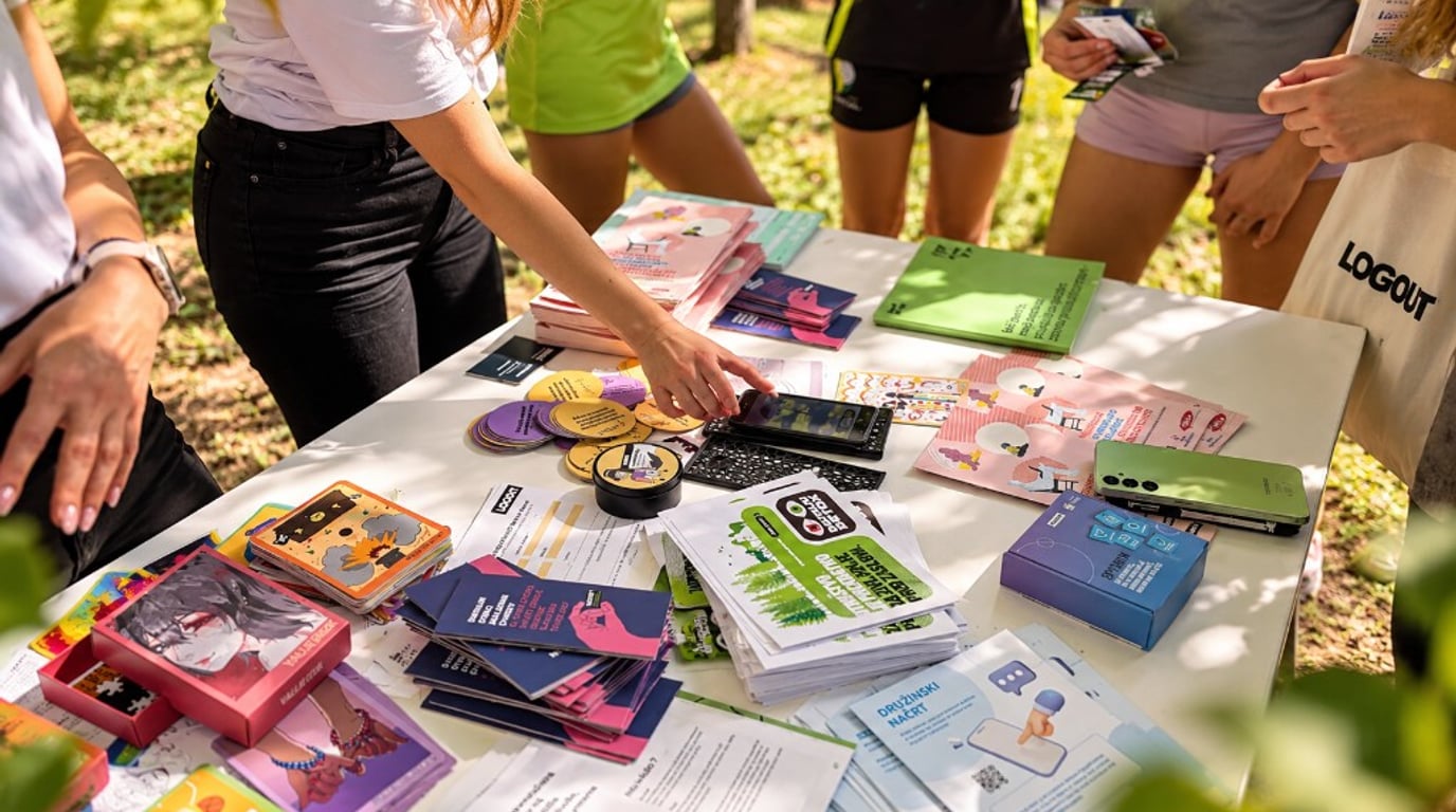 An outdoor youth information stand with Logout materials